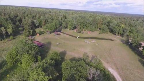 an aerial view of a large field with trees at Aadniel's Holiday Village in Aula