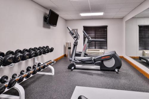 a gym with cardio equipment in a room at Country Inn & Suites by Radisson Raleigh-Durham Airport NC in Morrisville