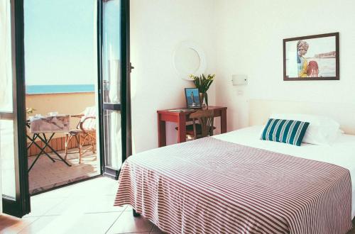 Voodi või voodid majutusasutuse Hotel Sirenetta toas