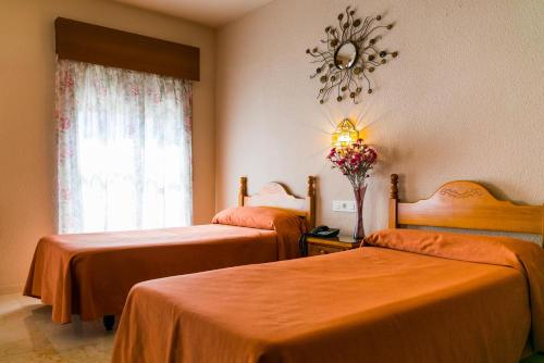 Cama ou camas em um quarto em Hotel La Nava