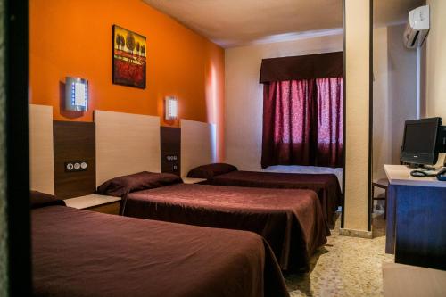 Postel nebo postele na pokoji v ubytování Hotel La Nava