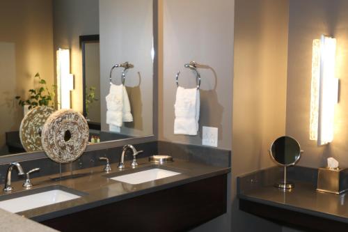 a bathroom with two sinks and a mirror at Little Creek Casino Resort in Kamilche