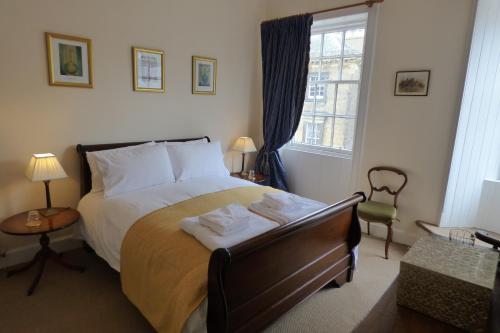 a bedroom with a bed with two towels on it at 1 HAVANNAH COURT in Kelso