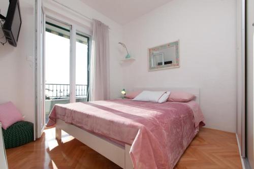 Voodi või voodid majutusasutuse Apartman Ivandić Podgora toas