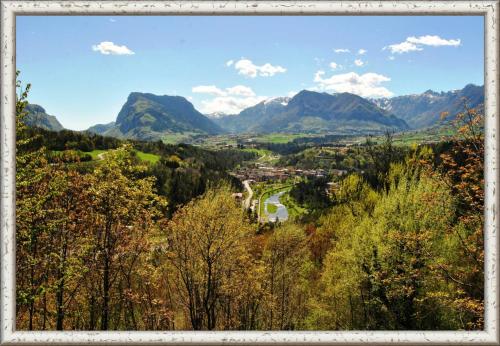 a view of a valley with mountains in the background at Albergo Genzianella in Fiavè
