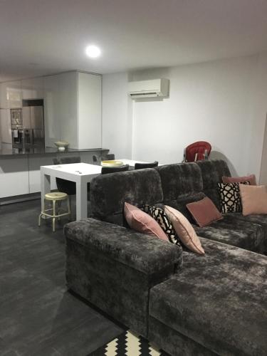 a living room with a couch and a table at ALTAMIRA HOUSE in Viana do Castelo