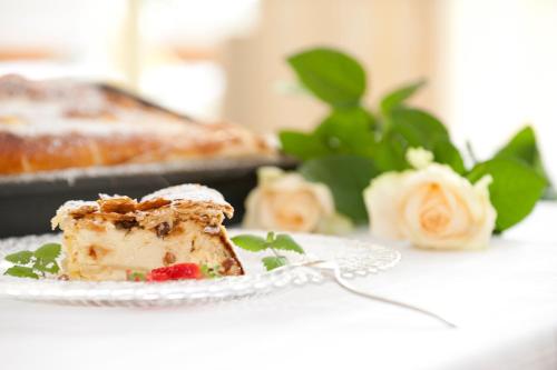 a piece of cake on a plate on a table at Hotel-Restaurant Gollner in Lebring