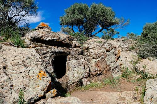 a cave in a rock on a mountain at Agriturismo Conca' e Janas in Dorgali