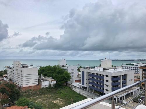 a view of a city with buildings and the ocean at Apartamento na Praia de João Pessoa in João Pessoa