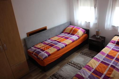 Posteľ alebo postele v izbe v ubytovaní Apartments Zoni
