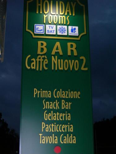 a sign for a bar caffe nuckee at Caffè Nuovo 2 Holiday Rooms in Trappitello