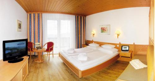 En eller flere senger på et rom på Hotel Alpengasthof Hochegger