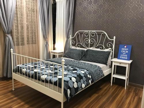 a bedroom with a bed and a sign that says self love runs at Bayu TAMARA RESIDENCE PUTRAJAYA in Putrajaya