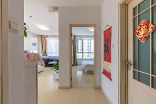 Φωτογραφία από το άλμπουμ του Dalian Xiuzhu Mansion Apartment σε Dalian