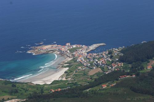 an aerial view of a beach and the ocean at Hotel El Pescador in Perillo