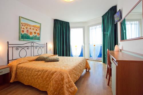 Postel nebo postele na pokoji v ubytování Hotel Catto Suisse