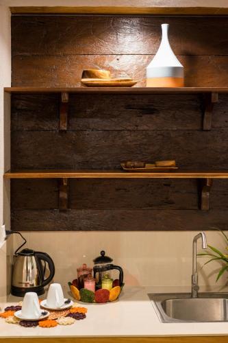 a kitchen counter top with a sink and a counter top with a sink at La Estancia Busuanga in Busuanga
