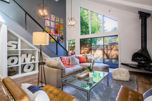 a living room with a couch and a glass table at 758 Broadway House in Sonoma