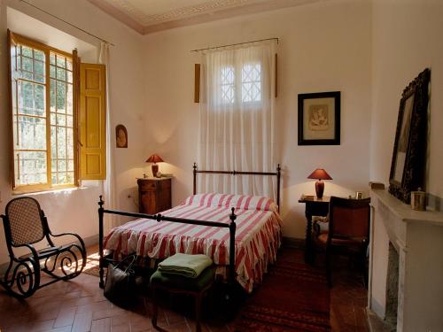 A bed or beds in a room at Castello di Grotti