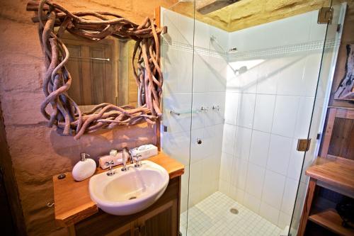 a bathroom with a sink and a shower at Snowy Wilderness in Ingebyra