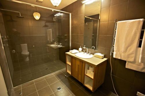 a bathroom with a sink and a shower at Snowy Wilderness in Ingebyra