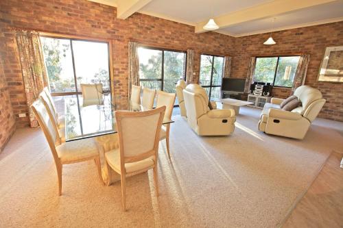 a living room filled with chairs and a table at Snowy Wilderness in Ingebyra
