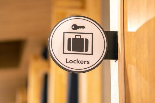 a sign on a building that reads locksers at I-Link Hostel & Cafe Shimanami in Imabari