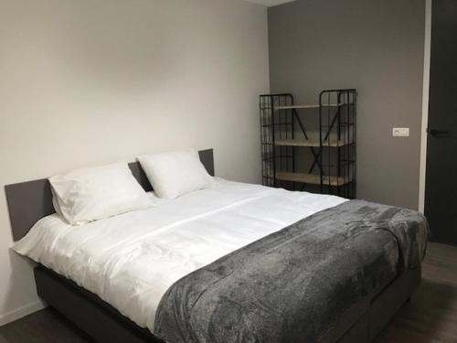 Кровать или кровати в номере Hoeve Oude Tol