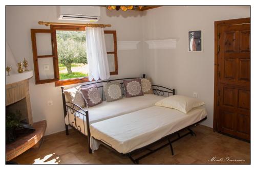 Ένα ή περισσότερα κρεβάτια σε δωμάτιο στο Liodentro House