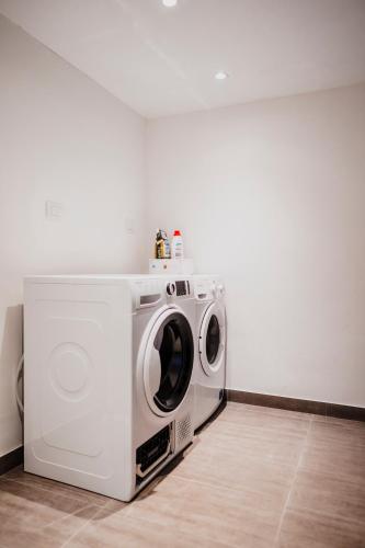 a washer and dryer sitting in a room at Casa Romeo in Cuneo