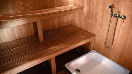 a small bathroom with a toilet and a sink at Mikalojiškis in Inturkė
