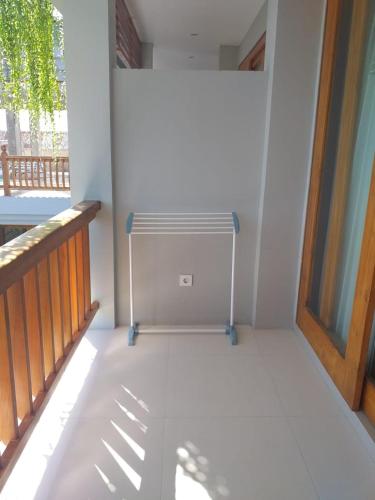 a empty room with a radiator on a balcony at Komodo Lodge in Labuan Bajo