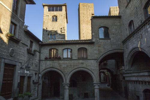 a building with two towers on top of it at Al Libro Letto in Viterbo