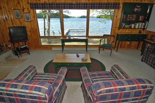 a living room with a couch and a coffee table at Ranch-Style Seidls Home in Namekagon