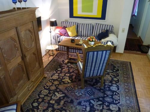 a living room with a couch and a table at Duschenhof in Fuhrberg