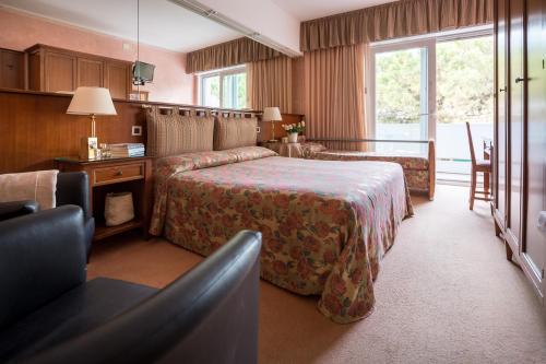 Postel nebo postele na pokoji v ubytování Hotel Astro