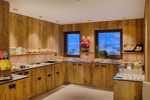 a large room with wooden walls and aasteryasteryasteryasteryasteryasteryasteryastery at K1 Mountain Chalet - Luxury Apartements in Brunico