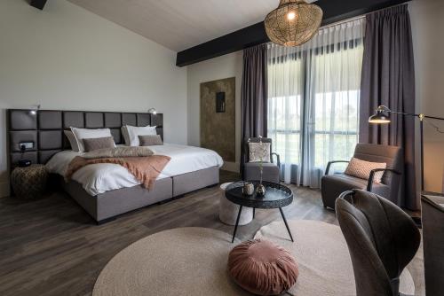 Postel nebo postele na pokoji v ubytování Fruitpark Hotel & Spa