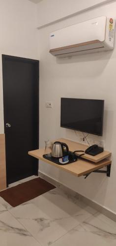 Телевизия и/или развлекателен център в Angson Apartment