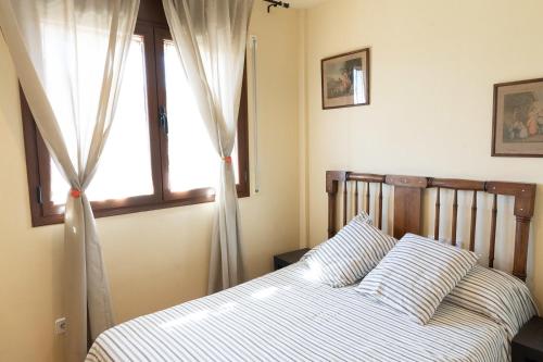 Postel nebo postele na pokoji v ubytování Apartaments Espai d'Àger