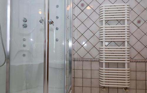 a white towel rack in a bathroom with a shower at B&B Villa Maria in Agropoli