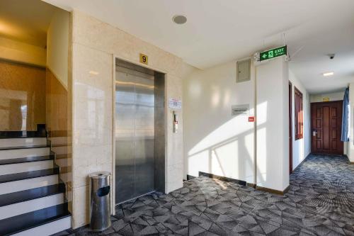 a hallway of a building with a elevator at Saigonciti Hotel A in Ho Chi Minh City