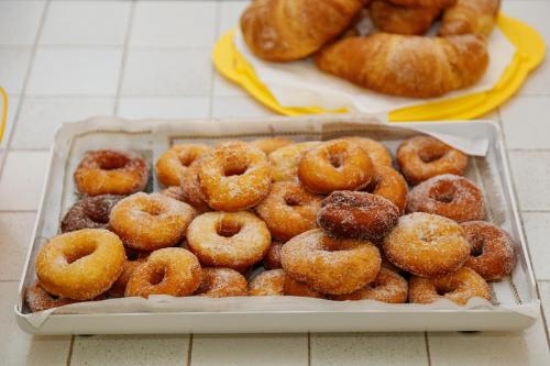 a tray of donuts sitting on top of a table at B&B Villa Maria in Agropoli