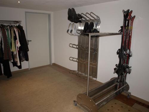 a room with skis on a rack and a closet at Haus Binder in Ried im Zillertal