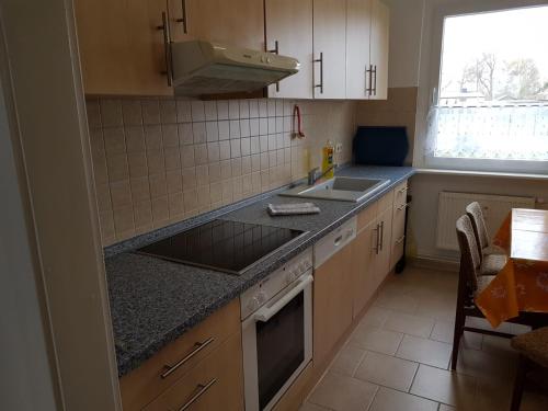 a kitchen with a sink and a counter top at Ruhige Ferienwohnung nahe Ostsee (30km) in Voigtsdorf/Nordvorpommern in Glewitz