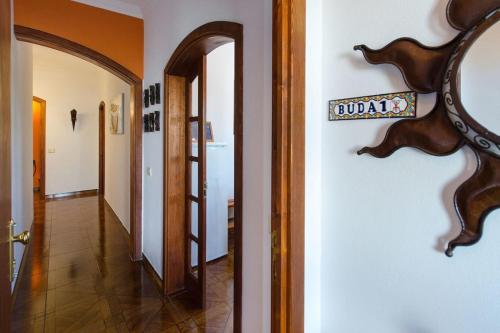 a hallway of a house with a sign on the wall at Buda in Tinajo