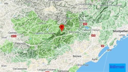 une carte de la ville de madrid avec un marqueur rouge dans l'établissement Maison du Caroux, with a pool with an amazing view, à Saint-Martin-de-lʼArçon