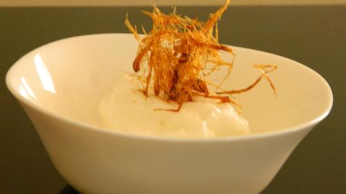 a white bowl with some food in it at Hotel Restaurant L Echo du Lac in Gérardmer