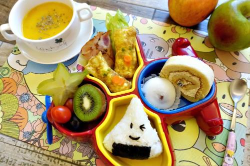 a childs lunch box with food and a cup of soup at 依比鴨鴨水岸會館 Ducking House in Ruisui