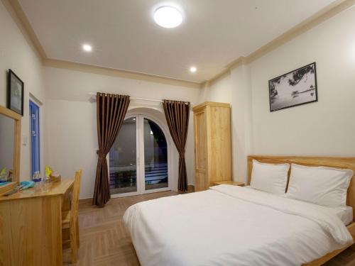 Postel nebo postele na pokoji v ubytování THIEN AN GUEST HOUSE